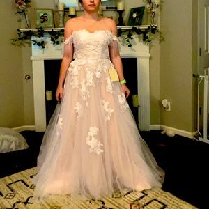 Tulle wedding dress with floral appliqués.